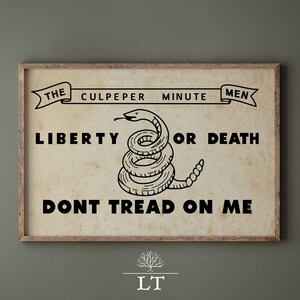 May include: A vintage-style print featuring a coiled rattlesnake with the text "The Culpeper Minute Men Liberty or Death Don't Tread On Me".