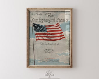 May include: A vintage poster featuring a depiction of the American flag waving in the wind with the words "The Star-Spangled Banner" and "Liberty and Justice for all" printed on it. The poster is framed in a wooden frame.