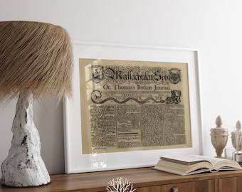 May include: A framed black and white print of a historical newspaper article titled "The Massachusetts Spy, Or, Thomas's Boston Journal." The article is dated Thursday, July 12, 1775. The text includes the words "Join or Die."