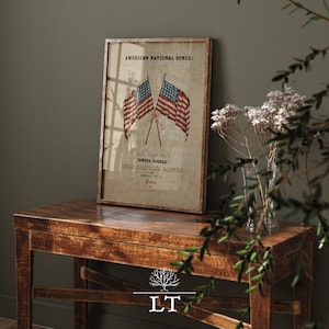 May include: A vintage framed print of American National Songs with two crossed American flags and the text "Hail Columbia, Yankee Doodle, Star Spangled Banner, Composed for the Piano."