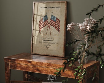 May include: A vintage framed print of American National Songs with two crossed American flags and the text "Hail Columbia, Yankee Doodle, Star Spangled Banner, Composed for the Piano."