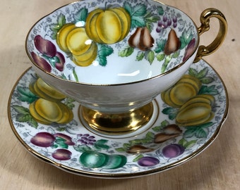 Teacup and saucer fine china with fruit motif quinces gooseberries plums grapes pears 'Old Royal Bone China'
