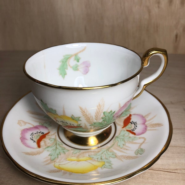 Cracked Royal Stafford fine china teacup and saucer hibiscus motif