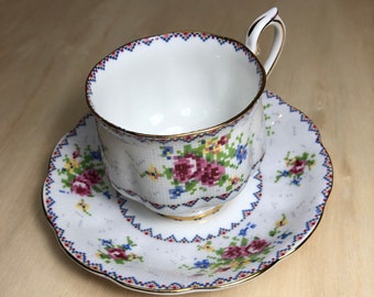 Royal Albert fine china teacup and saucer needlepoint roses motif gold chased