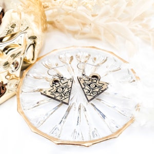 Millennium puzzles dangle earrings