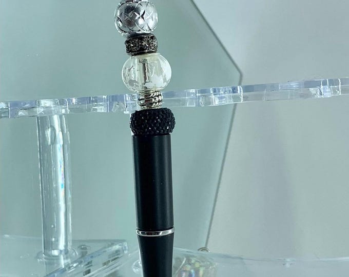 Bejeweled Black Crystal Writing Pen includes  1 charm
