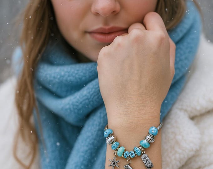 Winter Theme Charm Bracelet — highlighting the wintery snowflake and skate vibe.