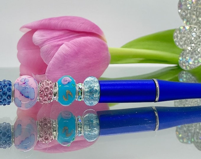 Bejeweled blue writing pen includes 1 charm of your choice