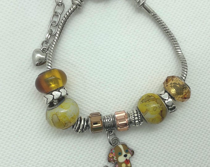 Dog Charm Beaded Bracelet – Amber Glass Beads & Mixed Metal Accents – Handmade Animal Lover Gift – Adjustable Silver Chain Jewelry.