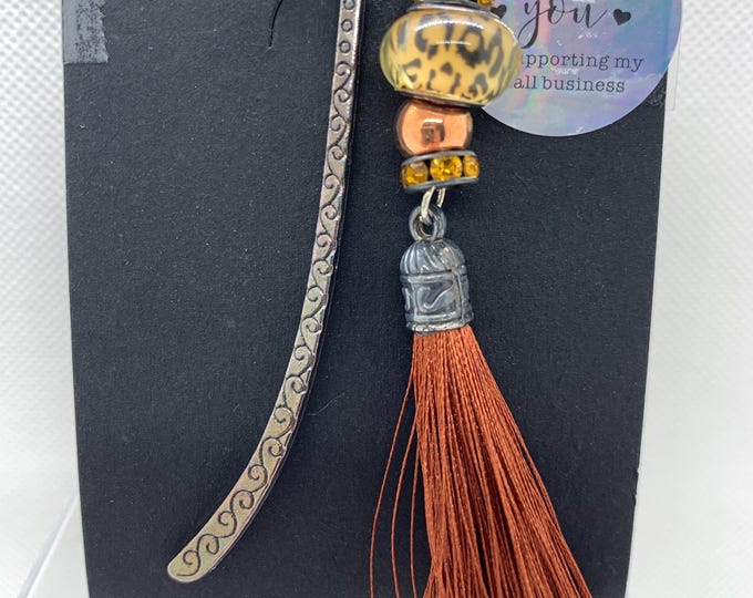 Book mark with orange tassel and gold bead