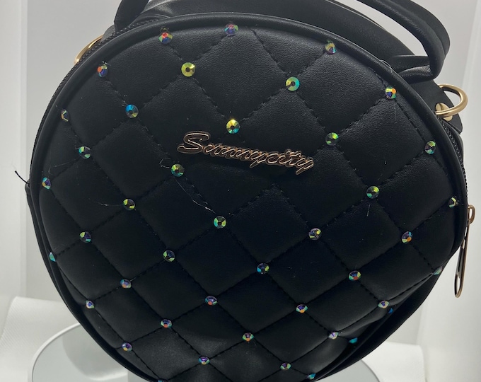 Elegant Black Quilted Handbag round shape with aurora studs and matching strap.