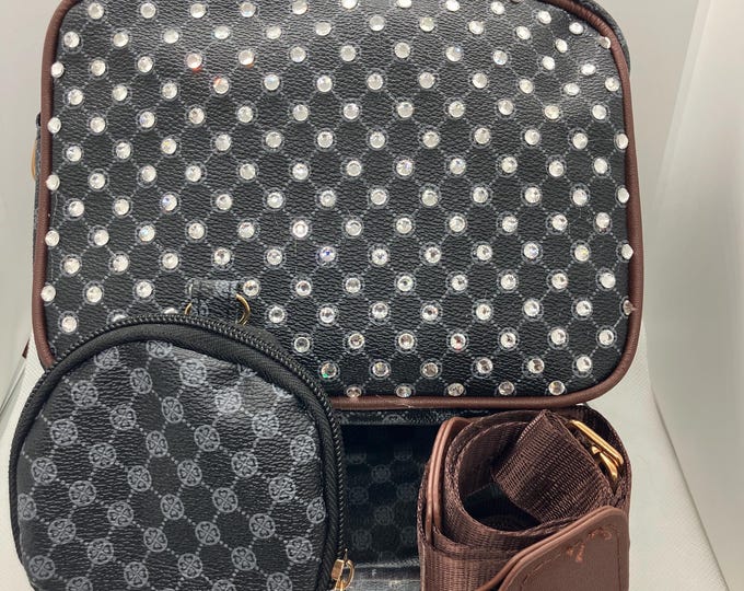 Black purse with brown piping, rhinestone studs, brown cross-body strap with matching change purse