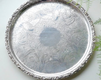 Silver Plated on Copper Round Tray with Moulding Details to the Rim and Intricate Patterns, by Barker Bros, Birmingham, circa 1900-10.