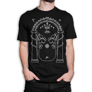 May include: Black t-shirt with a white outline of a doorway with two pillars, a crown, and stars. The text "All that is gold does not glitter, Not all those who wander are lost; The old that is strong does not wither, Deep roots are not reached by the frost. From the ashes a fire shall be woken, A light from the shadows shall spring; Renewed shall be blade that was broken, The crownless again shall be king." is written around the top of the doorway.
