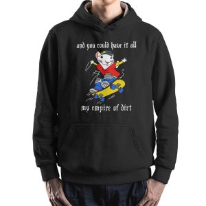 May include: Black hooded sweatshirt with a white graphic of a cartoon rat skateboarding. The text "and you could have it all my empire of dirt" is printed in white on the sweatshirt.