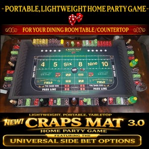 May include: A rectangular green craps mat with black foam walls, featuring white and yellow printed betting layouts, numbers 4, 5, Six, 8, Nine, 10, and text including Pass Line, Come, Field, and Horn. Stacks of colorful plastic chips line the edges.