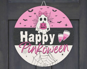 May include: Pink and black round door hanger with a ghost holding a pumpkin and the text "Happy Pinkoween".