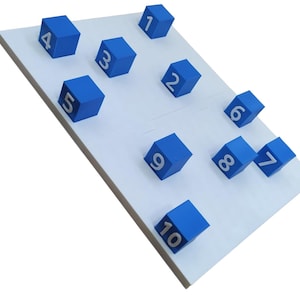 May include: A white board with ten blue blocks, each with a white number from 1 to 10.