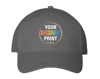 May include: A gray baseball cap with a white circle and the text "YOUR DESIGN PRINT" in colorful letters. The circle has three white stars at the bottom.