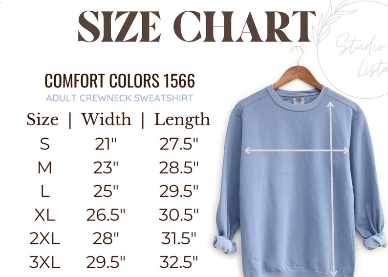 Puede incluir: Una sudadera de cuello redondo azul claro para adultos en una percha, con una tabla de tallas. La tabla enumera las tallas S a 3XL, con las medidas correspondientes de ancho y largo en cent&iacute;metros. El texto dice "COMFORT COLORS 1566".