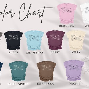 May include: Color chart showing 10 different t-shirt colors with a floral design. The colors are: Pepper, Black, Chambray, Berry, Ivory, Midnight, Blue Spruce, Espresso, Orchid, Blossom, and White.