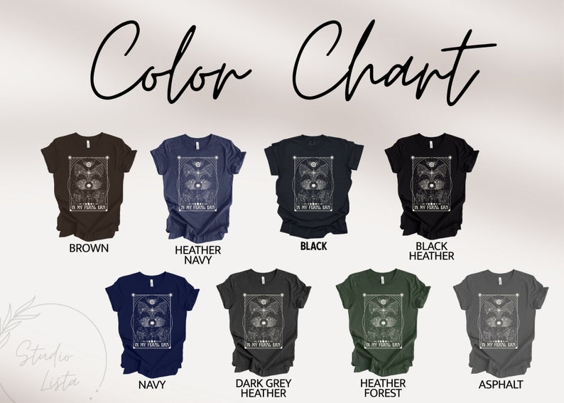 Puede incluir: Carta de colores que muestra diferentes colores de camisetas con un dise&ntilde;o gr&aacute;fico de un ojo celestial con el texto "In My Astral Eyes". Los colores que se muestran son marr&oacute;n, azul marino jaspeado, negro, negro jaspeado, azul marino, gris jaspeado oscuro, verde jaspeado bosque y asfalto.