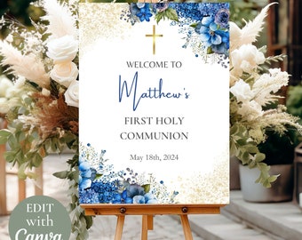 May include: Welcome to Matthew's First Holy Communion sign with blue watercolor flowers and gold glitter. The date May 18th, 2024 is printed on the sign.