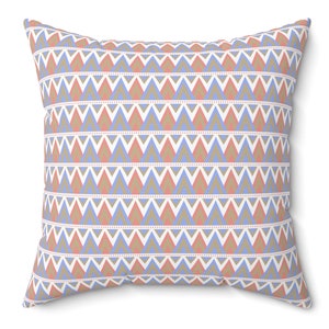 May include: A decorative throw pillow with a geometric pattern featuring blue, pink, and brown triangles on a white background.