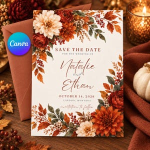 May include: A Save the Date wedding card featuring autumn-themed floral illustrations of dahlias and leaves in shades of rust, orange, and cream. The text reads: Save the Date for the wedding of Natalie and Ethan, October 14, 2028, Landon, Montana.