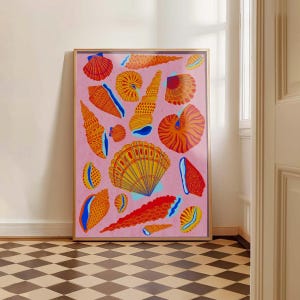 May include: A framed art print featuring a collection of colorful seashells in shades of orange, yellow, and red against a pink background. The seashells are of various shapes and sizes, with blue accents. The artwork is displayed in a room with a checkered floor.