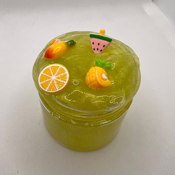 Tropical Punch slime, clear green slime with glitters and 4 holiday charms and pineapple scent! Great texture! Slime shops, 8oz