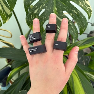 Keyboard key rings - *Symbols and Command Keys *- upcycled keyboards, mounted on adjustable base