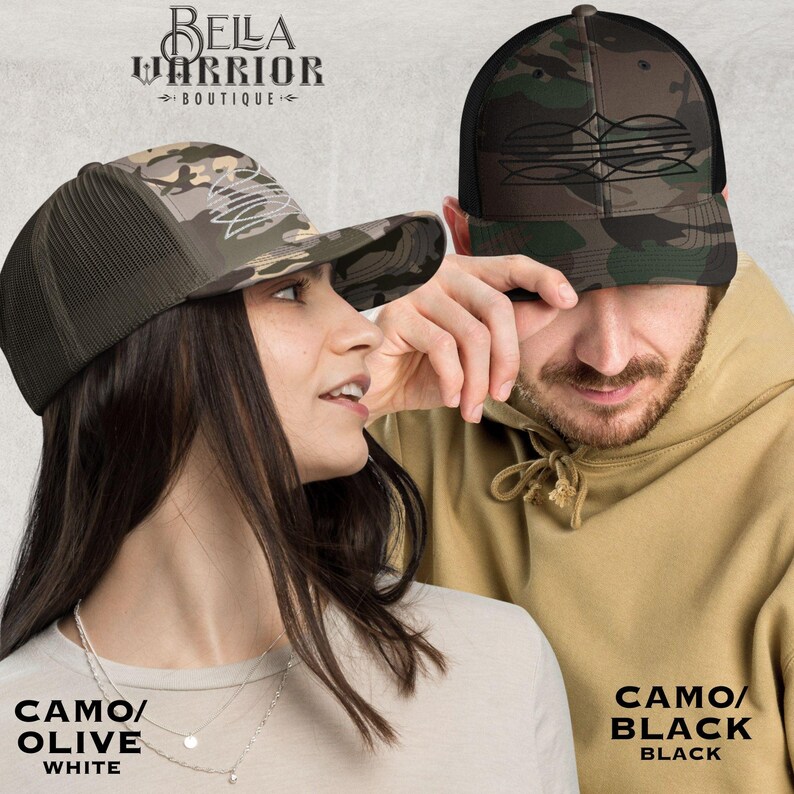 May include: Two camouflage trucker hats. One hat is camo/olive with a white front, the other is camo/black with a black front. The hats have a mesh back and a curved brim. The text "BELLA WARRIOR BOUTIQUE" is at the top.