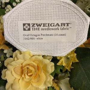 May include: White Zweigart The Needlework Fabric Oval/Octagon Patchmate (14 count) 3102/001-white Aida cloth for cross stitch projects.