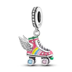 May include: Silver charm featuring a pink roller skate with rainbow stripes, green accents, and white wings. The skate has two blue and two pink gem-encrusted wheels. The charm has a silver star-shaped bail.