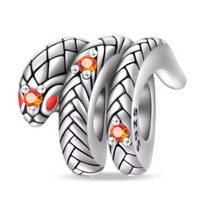 May include: Silver charm featuring two intertwined snakes with orange gemstone accents. The charm is marked with "S925" on the side.