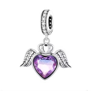 May include: A silver charm with a heart-shaped, purple gemstone, wings, and a crown. The charm has a ring with clear stones at the top for attaching to a bracelet or necklace. The charm is made of 925 sterling silver.