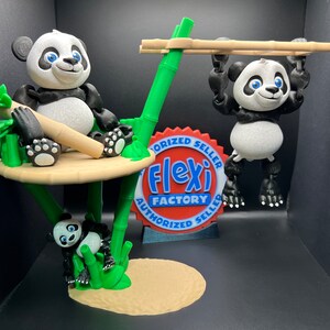 May include: Three black and white panda bear figurines on a green bamboo jungle playset. The panda bears are articulated and poseable. The playset includes a platform, a swing, and a climbing structure. The playset is made of plastic and is suitable for children.