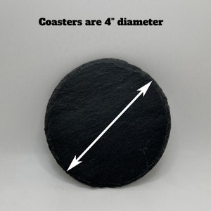 May include: A black slate coaster with a white arrow pointing to the 4 inch diameter.  Coasters are 4" diameter.