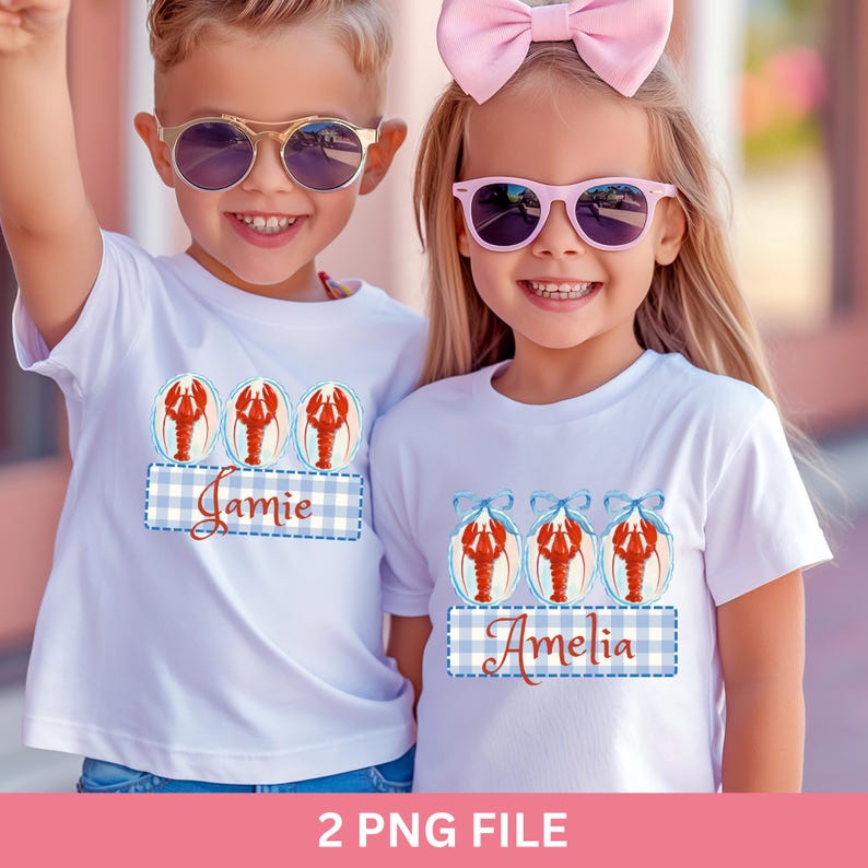 May include: Two children wearing white t-shirts with a lobster design. The shirts have a blue and white gingham pattern with a name on each shirt. One child is wearing sunglasses and the other has a pink bow.