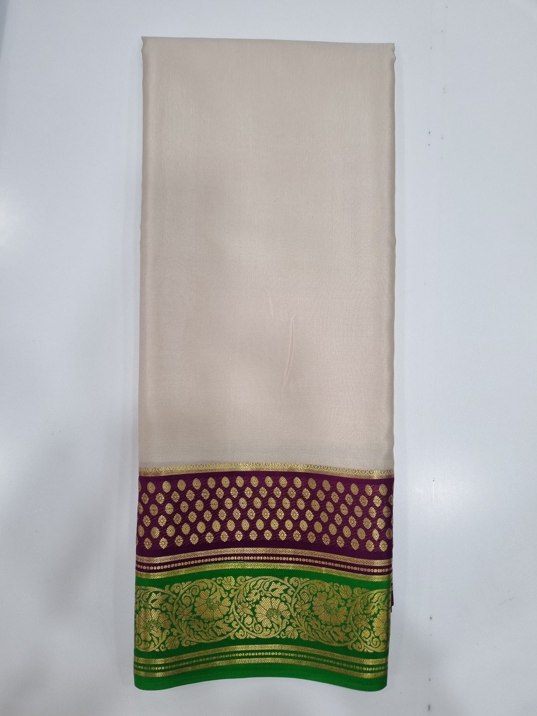 Green zari buttas fancy tussar silk saree, zari bentex border, plain pallu, and a matching zari striped blouse