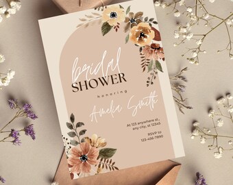 May include: A beige bridal shower invitation with a watercolor floral design in shades of brown, orange, and yellow. The text reads "bridal shower honoring Amelia Smith" and includes contact information for RSVP.