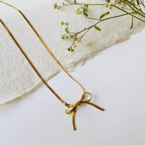 Dainty Gold Bow Necklace: 18K Gold Over Stainless Steel