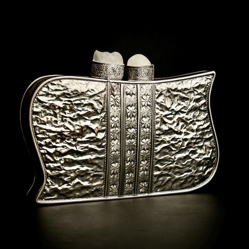 Art deco inspired silver clutch with mother of pearl body