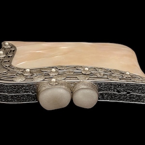 Formal evening handbag with luxury silver frame and decorative clasp