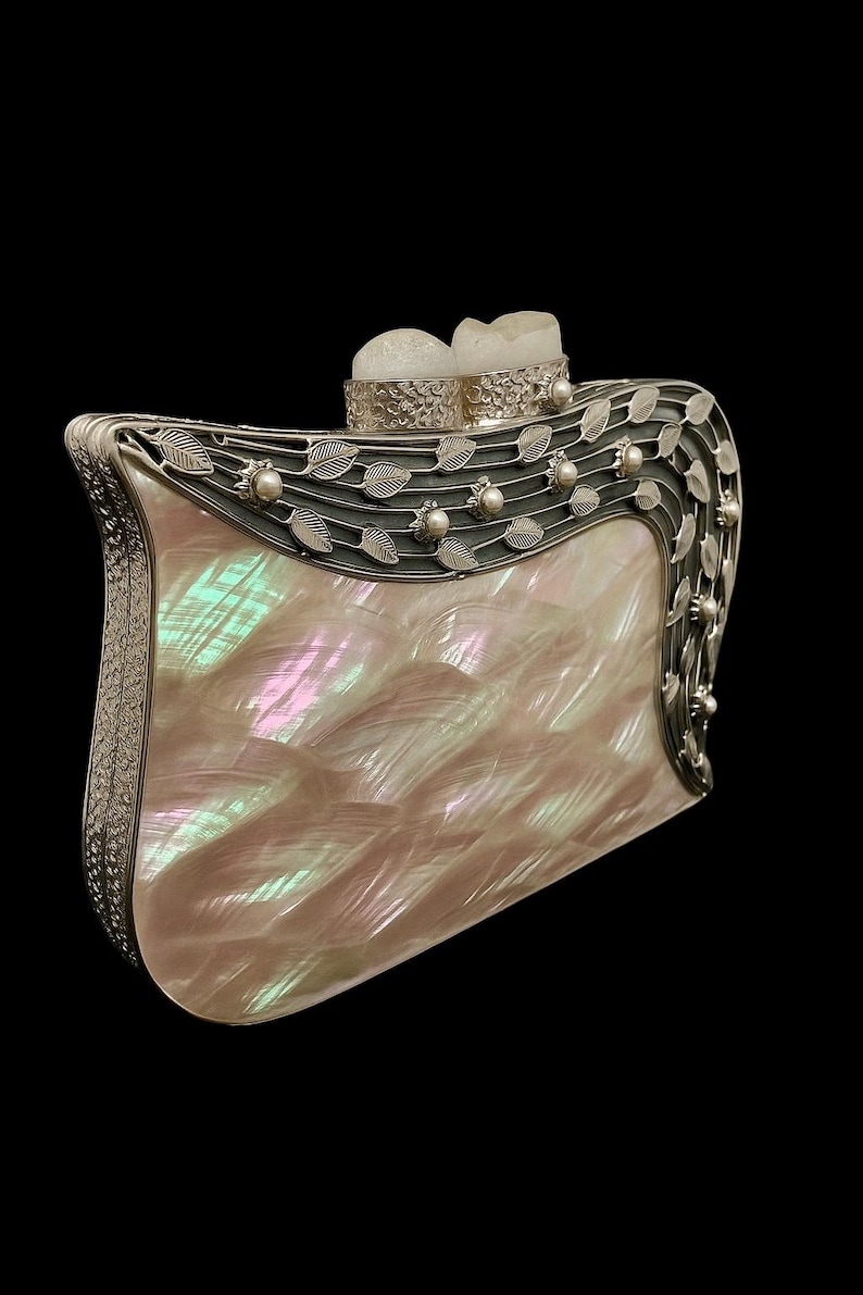Pearl embellished evening purse with designer metal frame