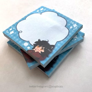 May include: Stack of blue and white sticky notes with a cartoon character thinking in a thought bubble. The character has black hair, brown eyes, and is wearing a red shirt. The notes have a polka dot pattern and white stars.