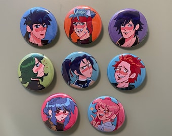 May include: Set of 8 round pinback buttons featuring anime-style characters with colorful backgrounds. The characters have different hair colors and styles, and some are wearing hats. The buttons are approximately 1 inch in diameter.