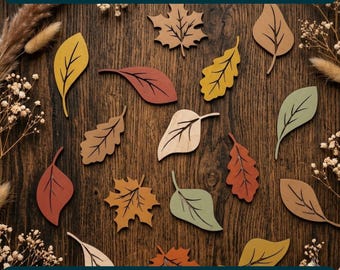 May include: A set of laser-cut wooden autumn leaves in various shapes and colors including yellow, orange, red, green, and brown. The text WOODEN AUTUMN LEAVES SET LASER CUT and CDR DXF PNG EPS SVG PDF is visible at the top and bottom of the image.