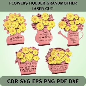 Op de afbeelding: Lasergesneden houten bloemenhouders in diverse vormen, elk met gele papieren bloemen. De roze houders bevatten teksten als "Oma, je bent zo speciaal!" en "Bloemen voor jou."